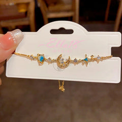 Model wearing the 14K Gold-plated Exquisite Diamond Blue Star And Moon Bracelet to highlight its design on the wrist