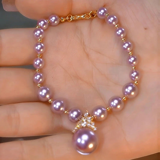 Model wearing the 14K Gold-plated Exquisite Diamond Purple Pearl Bracelet to highlight its design on the wrist