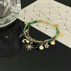 Close-up of the clasp and charm details on the Star And Moon Beaded Bracelet