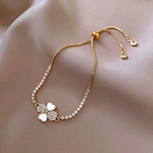 Model wearing the 14K Gold-plated Exquisite Zircon Adjustable Four-Leaf Bracelets to highlight its design on the wrist