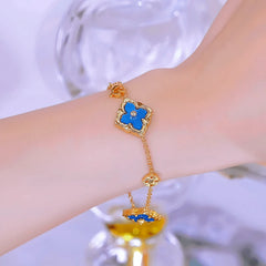 Close-up of the clasp and charm details on the Four-Leaf Clover Bracelets