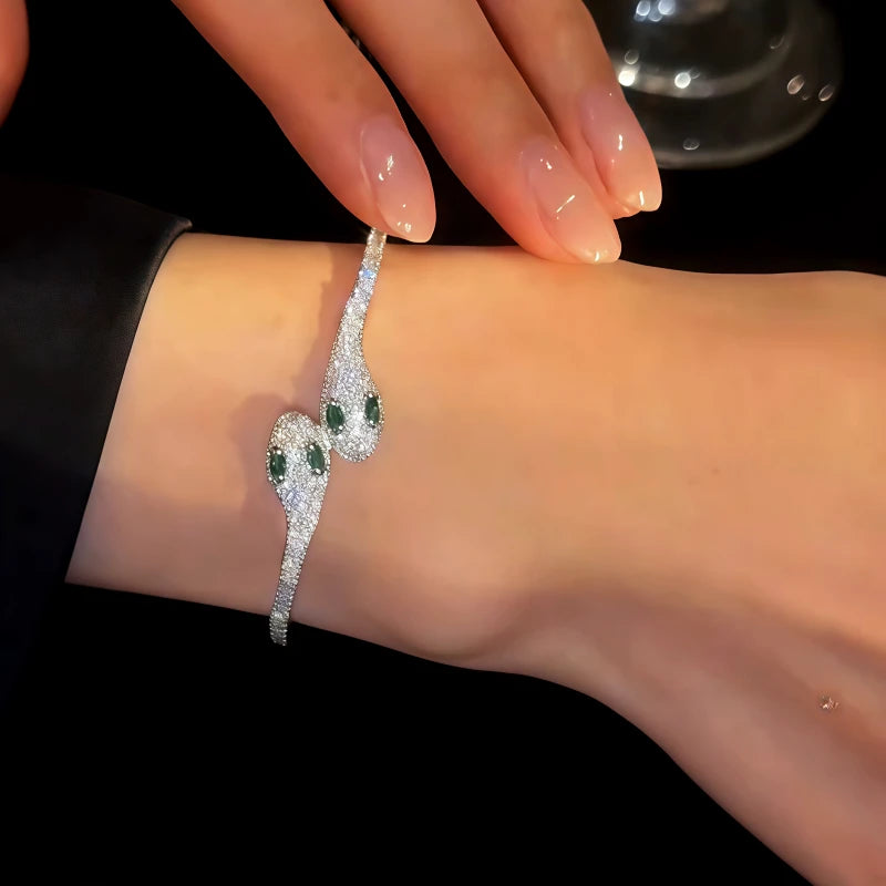 Model wearing the 14K Gold-plated Exquisite Zircon Double Snake Bracelets to highlight its design on the wrist