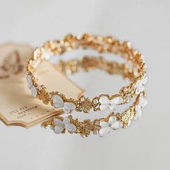 Close-up of the clasp and charm details on the Pearl Butterfly Bracelets