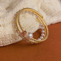 Close-up of the clasp and charm details on the Pearl Stacking Bracelets