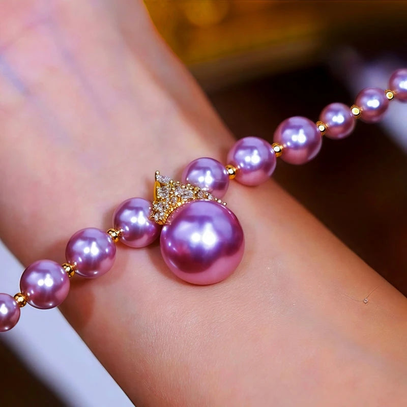 Model wearing the 14K Gold-plated Exquisite Zircon Purple Pearl Bracelet to highlight its design on the wrist