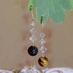 Angled view of the 14K Gold-plated Geometric Diamond Pearl Earrings