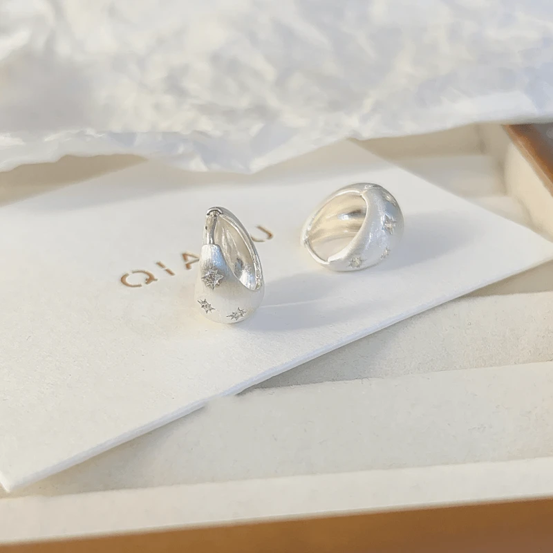 Angled view of the 14K Gold-plated Luxury Brushed Drop Earrings