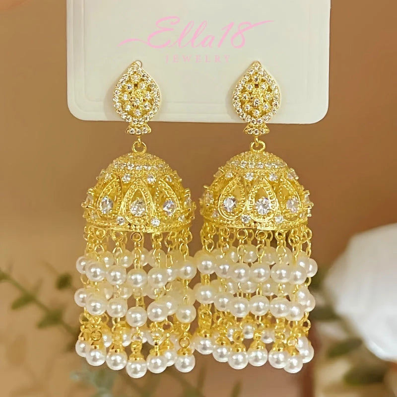 Model showcasing the dangle and style of the 14K Gold-plated Luxury Diamond Curtain Tassel Pearl Earring