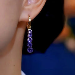 Close-up detail of the sparkling zircons and plating on the Purple Diamond Earrings