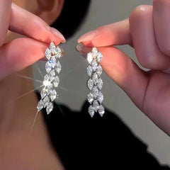 Close-up detail of the sparkling zircons and plating on the Zircon Tassel Earrings