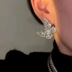 Model showcasing the dangle and style of the 14K Gold-plated Luxury Zircon Butterfly Earrings