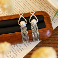 Angled view of the 14K Gold-plated Pearl Tassel Earrings