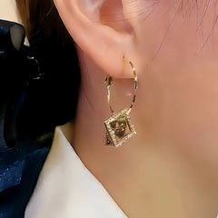 Close-up detail of the sparkling zircons and plating on the Square Crystal Earrings