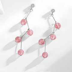 Close-up detail of the sparkling zircons and plating on the Strawberry Crystal Earrings