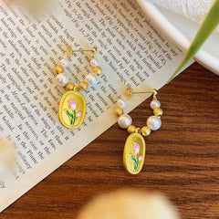 Close-up detail of the sparkling zircons and plating on the Tulip Pearl Earrings