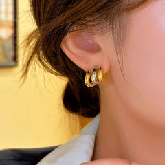 Close-up detail of the sparkling zircons and plating on the Three-Layer Studs