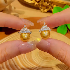 Close-up detail of the sparkling zircons and plating on the Crown Stud Earrings