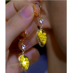 Close-up detail of the sparkling zircons and plating on the Durian Fruit Earrings