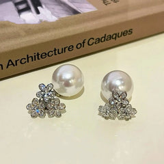 Angled view of the 14K Gold-plated Zircon Flower Jacket Earrings