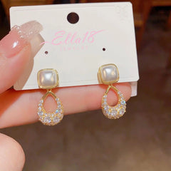 Angled view of the 14K Gold-plated Zircon Geometric Pearl Earrings