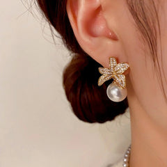 Close-up detail of the sparkling zircons and plating on the Golden Leaf Pearl