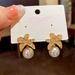 Angled view of the 14K Gold-plated Zircon Leaf Pearl Earrings