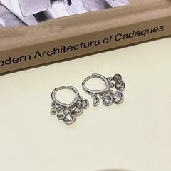 Close-up detail of the sparkling zircons and plating on the Tassel Earrings