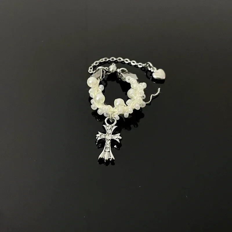 Top-down view of the sparkling Beaded Zircon Gold Cross Ring | 14K Gold Plated