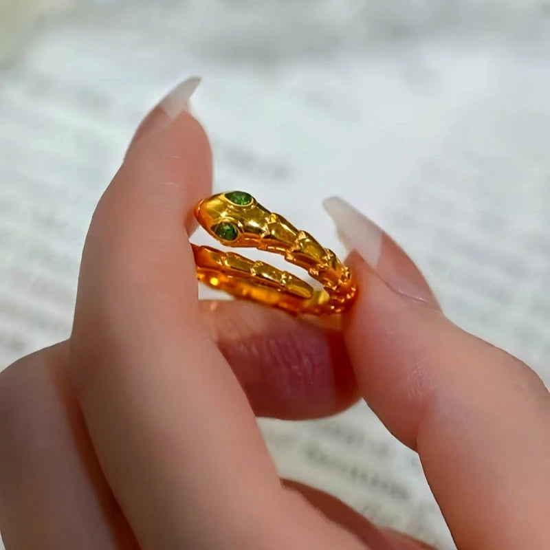 Top-down view of the sparkling Emerald Eye Gold Snake Ring | 14K Gold Plated
