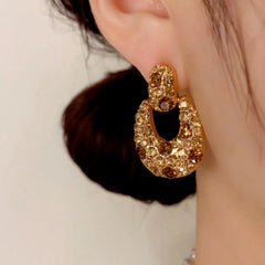 Model showcasing the dangle and style of the 14K Gold Plated Brown Diamond Earrings