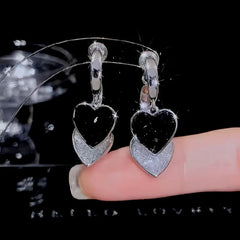 Angled view of the 14K Gold Plated Crystal Double-Heart Earrings