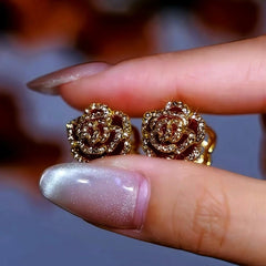 Angled view of the 14K Gold Plated Diamond Camellia Earrings