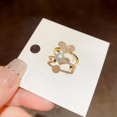 Close-up view of the gemstone and setting of the gold heart ring