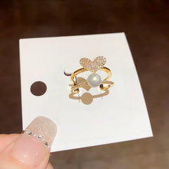 14K Gold Plated Double-Layer Zircon Heart Pearl Adjustable Rings worn on the hand to show its beautiful fit and design