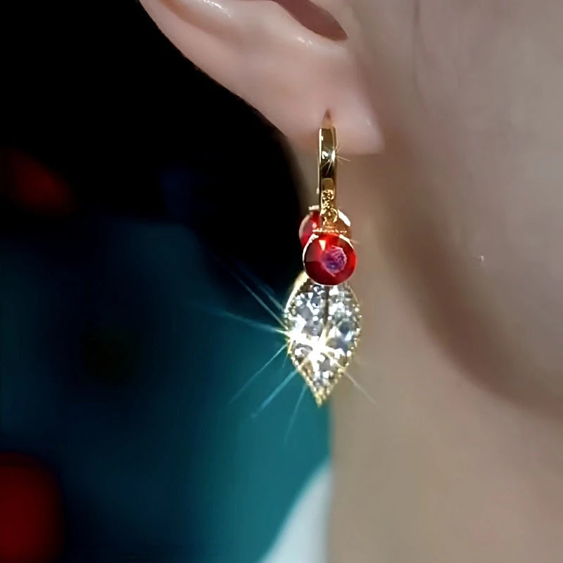 Close-up detail of the sparkling zircons and plating on the red drop earrings