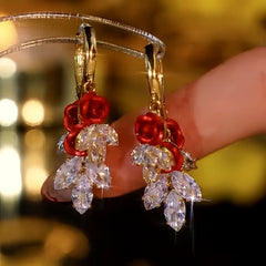 Close-up detail of the sparkling zircons and plating on the red drop earrings