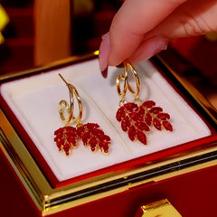 Close-up detail of the sparkling zircons and plating on the red drop earrings