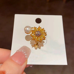 Top-down view of the sparkling Sunflower Spinner Anxiety Ring | 14K Gold Plated