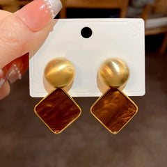 Angled view of the 14K Gold Plated Simple Square Earrings