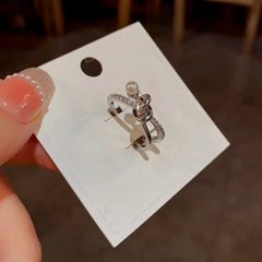 Top-down view of the sparkling Pearl & Zircon Gold Cross Ring | 14K Gold Plated