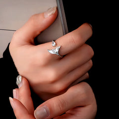 Close-up view of the gemstone and setting of the gold mermaid ring