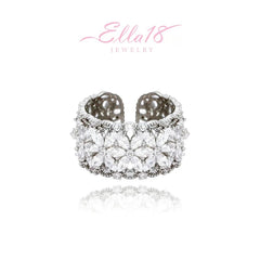 Close-up view of the gemstone and setting of the gold flower ring