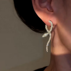Angled view of the 14K Gold Plated Zircon Snake Earrings