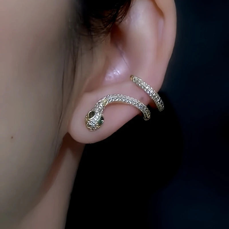 Close-up detail of the sparkling zircons and plating on the gold snake earrings