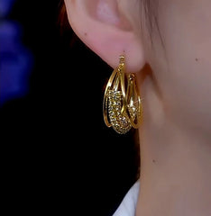 Close-up detail of the sparkling zircons and plating on the Twisted Zircon Hoops