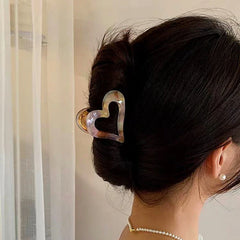 Angled view of the stylish 14K gold-plated Heart-Design Hair Clips