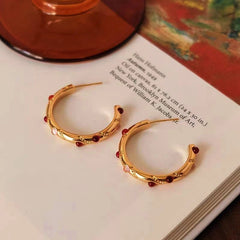 Angled view of the 18K Gold-Plated Agate C-Shaped Earrings