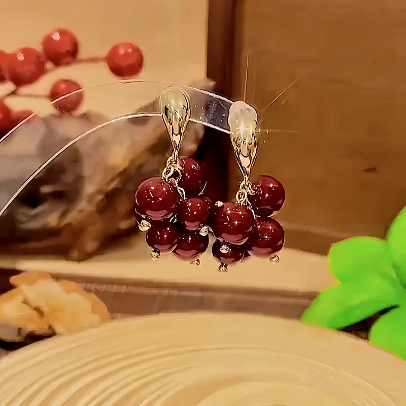 Close-up detail of the sparkling zircons and plating on the Grape Earrings