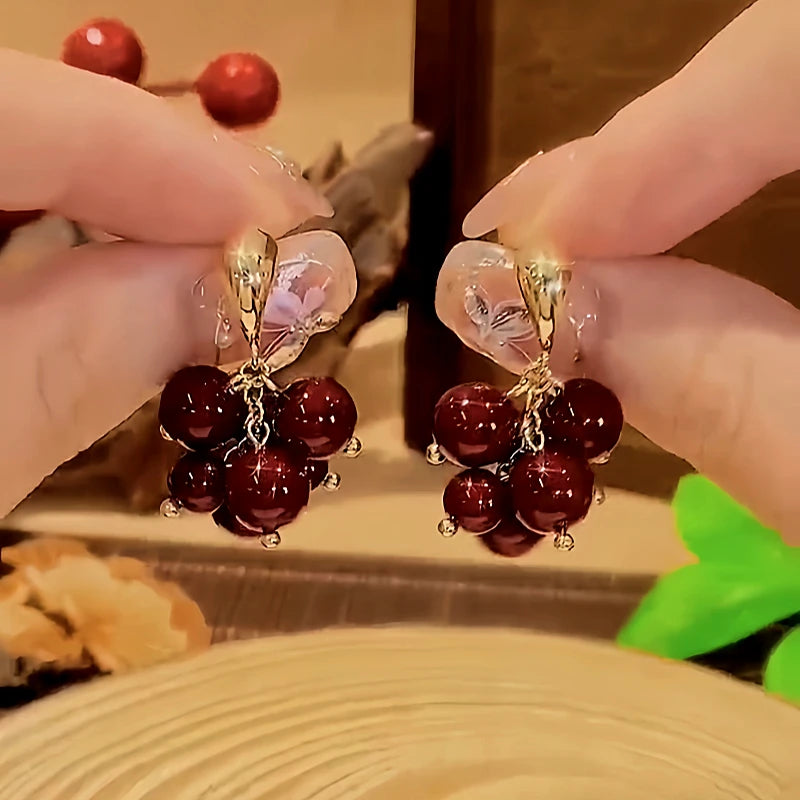 Angled view of the 18K Gold-Plated Bunch Of Grape Earrings