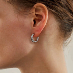 Close-up detail of the sparkling zircons and plating on the C-Shaped Earrings